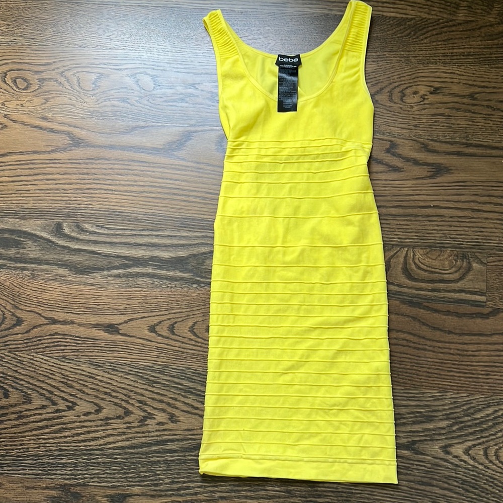 Bebe yellow bodycon mini dress with cutout in back